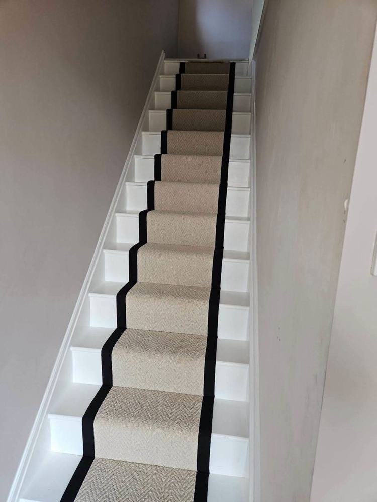 Herringbone stair runner carpet with black binding fitted by BDL Carpets & Vinyl